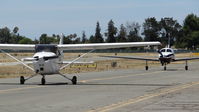 N61637 @ KRHV - A locally based 1975 Cessna 172M taxing out for departure while a local Piper Malibu Matrix taxis to its hangar at Reid Hillview Airport, CA. - by Chris Leipelt