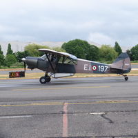 N22KY @ KRNT - Piper L-21 about to take off and tow a aerial banner. - by Eric Olsen
