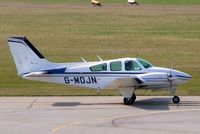 G-MDJN @ EDNY - Beech 95-B55 Baron [TC-1574] Friedrichshafen~D 03/04/2009 - by Ray Barber