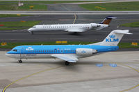 PH-KZA @ EDDL - PH-KZA on apron with D-ACNK taxiing - by Günter Reichwein