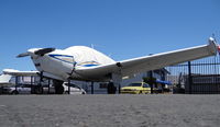 N7948D @ KRHV - Locally-based 1957 Beechcraft H35 Bonanza (with cover) parked on the Nice Air ramp at Reid Hillview Airport, San Jose, CA. - by Chris Leipelt