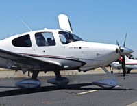 N744TC @ KRHV - Sterling Silver Aviation LLC (Monte Sereno, CA) 2007 Cirrus SR22 puffing out smoke while starting up at Reid Hillview Airport, San Jose, CA. I bumped up the definition to make the smoke easier to see. - by Chris Leipelt