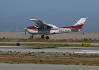 N6035N @ KSQL - 1978 Cessna 210M in new colors making crosswind landing @ San Carlos Airport, CA - by Steve Nation