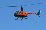 N447S @ KSQL - 2005 Robinson R44 in flyby @ San Carlos Airport, CA - by Steve Nation