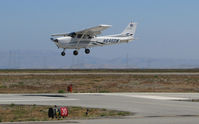 N646DW @ KSQL - San Carlos Flight Center 2006 Cessna 172S over threshold @ San Carlos Airport, CA - by Steve Nation