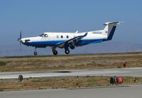 N805SA @ KSQL - Surf Air 2004 Pilatus PC-12/45 near touchdown on flight from KHHR (Hawthorne Airport, CA) @ San Carlos Airport, CA - by Steve Nation