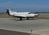 N828SA @ KSQL - Surf Airlines PC-12/47E making final checks for take-off to their San Diego Area terminal (KCRQ McClellan-Palomar Airport) @ San Carlos Airport, CA (SF Bay Area terminal) - by Steve Nation