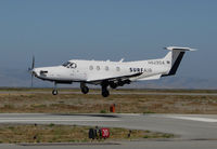 N829SA @ KSQL - Surf Airlines PC-12/47E over the threshold at its SF Bay Area operating base (San Carlos Airport) from KSBA (Santa Barbara Municipal Airport) - by Steve Nation