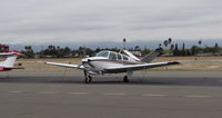 N7949K @ KRHV - Nevada-owned 1965 Beech S35 sitting on the transient ramp early in the morning at Reid Hillview Airport, San Jose, CA. - by Chris Leipelt