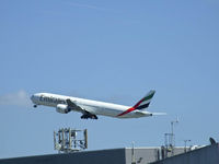 A6-EBV @ EGCC - Emirates B777-300 A6-EBV ,Photo taken on top of the multi storie carpark