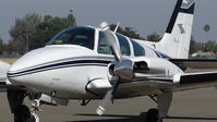 N555TK @ KRHV - Locally-based 1976 Beechcraft Baron 55 taxing back to its hangar via the inside ramp after some minor avionics work at Reid Hillview Airport, San Jose, CA. - by Chris Leipelt