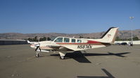 N587AN @ KRHV - Locally-based Beechcraft Baron 58 sitting at the south tie downs at Reid Hillview Airport, San Jose, CA while the Nice Air ramp gets resurfaced. This is the busiest you will ever see the south tie downs since (as of this date) there are only 11 a/c there. - by Chris Leipelt