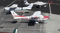 N14306 @ KPAO - Locally-based 2007 Cessna T182T sitting at its tie down at Palo Alto Airport, Palo Alto, CA. Photo taken from the control tower. - by Chris Leipelt
