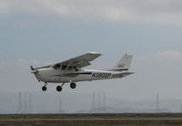 N380SP @ KSQL - Locally-Based 2001 Cessna 172S over threshold on an overcast morning @ San Carlos Municipal Airport, CA - by Steve Nation