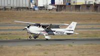 N5290E @ KRHV - Locally-based 2002 Cessna 172S landing runway 31L at Reid Hillview Airport, San Jose, CA. Photo taken from the control tower. - by Chris Leipelt