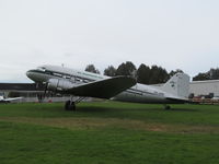 ZK-AWP @ NZAR - on a damp grass parking area at Ardmore - by magnaman