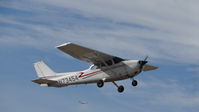N73454 @ KRHV - Locally-based 1976 Cessna 172M departing runway 31R at Reid Hillview Airport, San Jose, CA. Note the Delta CRJ on final to nearby KSJC San Jose Intl Airport in background. - by Chris Leipelt