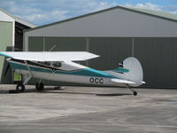 ZK-OCC @ NZHN - hidden in hangar cul de sac in central part of airport - by magnaman