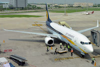 VT-JFS @ VIDP - Even before the aerobridge connects, the baggage is being handled at IGIA T-3. - by Arjun Sarup
