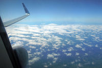 ZK-OXA - Snow-topped Mt Ruapheu is camouflaged in the clouds (AKL-WLG) - by Micha Lueck