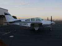 N931RD @ KOAK - 1963 Beech 95-A55 on Oakland International Airport, CA North ramp at sunset - by Steve Nation