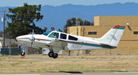 N1BF @ KRHV - Locally-based 1973 Beechcraft 55 landing runway 13R after coming in IFR from John Wayne at Reid Hillview Airport, San Jose, CA. - by Chris Leipelt