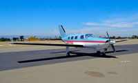 N9125B @ KRHV - Stockton Aviation Group LLC (Stockton, CA) colorful 1987 Piper Malibu parked on the transient ramp at Reid Hillview Airport, San Jose, CA. - by Chris Leipelt