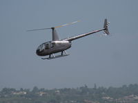 N7074N @ CMA - 2013 Robinson R44 RAVEN, Lycoming O-540-F1B5 260 Hp derated to 225 Hp for 5 minutes, 205 Hp continuous. Note: Mfg. year 2013. Approach to landing - by Doug Robertson