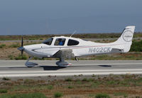 N402CK @ KSQL - Locally-based 2009 Cirrus Design SR22 Turbo rolling on takeoff @ San Carlos Airport, CA - by Steve Nation
