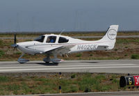 N402CK @ KSQL - Locally-based 2009 Cirrus Design SR22 Turbo rolling on takeoff @ San Carlos Airport, CA - by Steve Nation