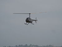 N7106Z @ CMA - 2014 Robinson R44 RAVEN II, Lycoming IO-540-AE1A5 245 Hp, approach to landing selling rides - by Doug Robertson