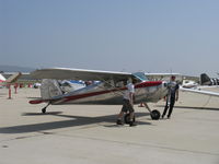 N3124N @ CMA - 1947 Cessna 120, Continental C85 85 Hp, spotting the aircraft-no taxi of arriving display aircraft between rows at an airshow for safety - by Doug Robertson