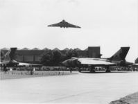 XM652 @ EGXP - XL317 flying over standing XL445 and XM652 at RAF Scampton Airshow, 1980. - by RAF Personnel - Crown Copyright