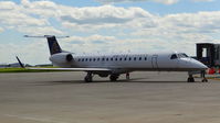 N12163 @ KATW - United Express 2004 Embraer 145XR sitting at the gate at Outagamie County Regional Airport, Appleton, WI. - by Chris Leipelt