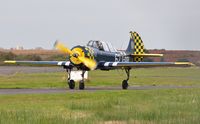 G-OUGH @ EGFH - Resident Yak-52 returning from a local flight. Coded 74/JA on starboard side. - by Roger Winser