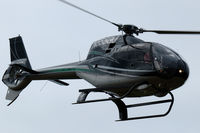 N555GJ @ EBDT - Eurocopter EC120B Colibri departing 2015 Schaffen-Diest fly-in.
It looks in a bit sinister in its dark colours. Piloted by two ladies. - by Van Propeller