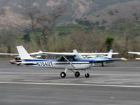 N704UT @ SZP - 1976 Cessna 150M, Continental O-200 100 Hp, landing roll Rwy 22 with full flaps down - by Doug Robertson