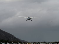 N704UT @ SZP - 1976 Cessna 150M, Continental O-200 100 Hp, climb go-around after balked landing attempt over Rwy 22 still with full flaps down - by Doug Robertson
