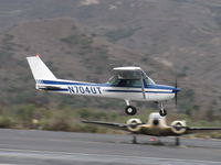 N704UT @ SZP - 1976 Cessna 150M, Continental O-200 100 Hp, on final Rwy 22 with balked landing go-around, near mid-field. Note full-flaps position - by Doug Robertson