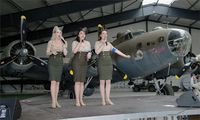 F-AZDX @ LFFQ - Boeing B-17G Flying Fortress Pink Lady, Behind The Manhattan Dolls singing group, La Ferté-Alais airfield (LFFQ) Air show 2015 - by Yves-Q
