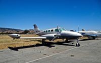 N821KB @ E16 - Locally-based 1966 Cessna 411 sitting at its tie down at South County Airport, San Martin, CA. Clearly it's been sitting for quite some time. - by Chris Leipelt