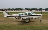 N430FM @ KOSH - Raytheon A36 - by Mark Pasqualino