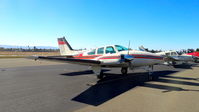 N810WA @ KRHV - Arizona-based 1967 Beechcraft D55 Baron sitting on the transient ramp a few hours before departure at Reid Hillview Airport, San Jose, CA. - by Chris Leipelt