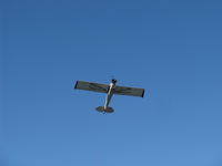 N3257B @ SZP - 1954 Piper PA-18-135 SUPER CUB, Lycoming O-320 upgrade, larger wings, aileron fences, droop tips. Restricted class aerial advertising. Steep power climb on first try successful banner pickup from Rwy 04R grass. A real Pro at work! - by Doug Robertson