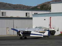 N3257B @ SZP - 1954 Piper PA-18-135 SUPER CUB, Lycoming O-320 upgrade, Note larger wings, aileron fences, droop tips, Restricted class aerial advertising, aircraft normally lady flown, taxi to Rwy 04 - by Doug Robertson