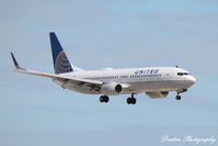 N77261 @ KSRQ - United Flight 1885 (N77261) arrives at Sarasota-Bradenton International Airport following flight from Chicago-O'Hare International Airport - by Donten Photography