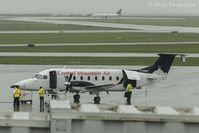 C-FCMV @ CYVR - All doors open, loading up.