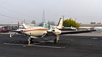 N587AN @ KRHV - Locally-based Beechcraft Baron 58 sitting in the fog at Reid Hillview Airport, San Jose, CA. - by Chris Leipelt