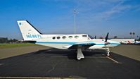 N6867L @ KRHV - Newly locally-based Cessna 421C parked on its temporary tie down in bright sunshine at Reid Hillview Airport, San Jose, CA. - by Chris Leipelt