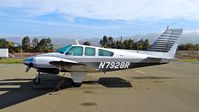 N7928R @ KRHV - Locally-based 1969 Beechcraft Baron 55 parked at the south tie downs at Reid Hillview Airport, San Jose, CA. - by Chris Leipelt